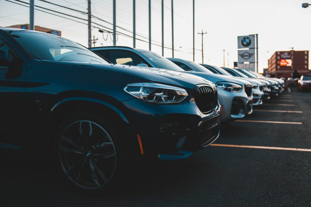 BMW Cars lined up at a dealership. Sell my car online with CarSolve.
